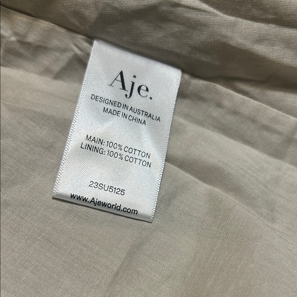 NWOT. Aje Novella Mini Smock Dress. Stylish Beige Dress with Ruffle Hem - Picture 8 of 13